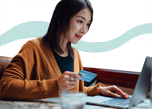 Woman sitting at desk using laptop