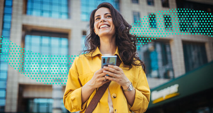 Woman holding a phone, smiling