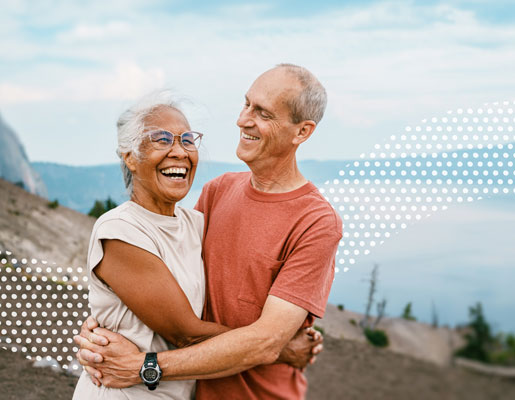 Woman smiling while holding eyeglasses