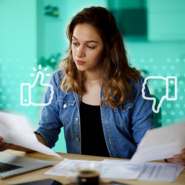 Woman comparing two documents in hand