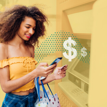 Images/Resources/Content Article Images/Inline Images/cc-fine-print-inline3.jpg Woman in front of an ATM looking at her phone