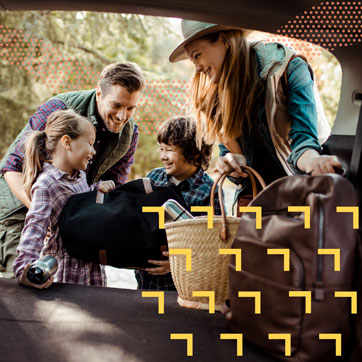 A young family getting the ready for a road trip