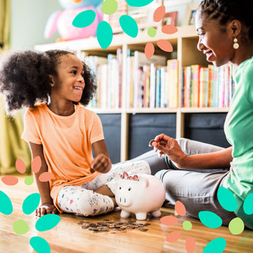 mother and daughter counting money from piggie bank